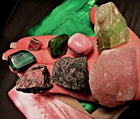 Left to Right Top: Malachite, Watermelon Tourmaline, Nephrite Jade, Rhodochrosite, Green Calcite. Bottom: Rhodonite, Emerald, Rose Quartz.